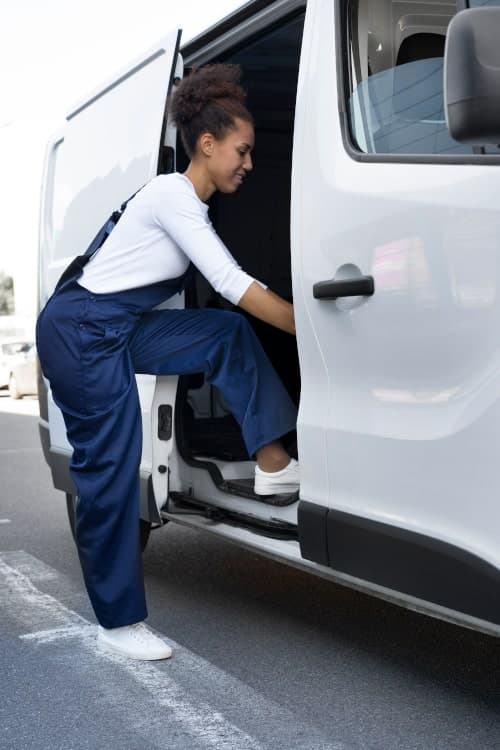 Female van driver unloading her van